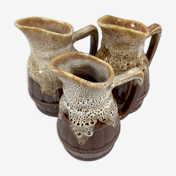 3 brown ceramic wine pitchers