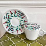 Antique herbal tea cup with mint infusion
