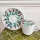 Antique herbal tea cup with mint infusion
