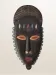 Masque mural en bois sculpté et peint