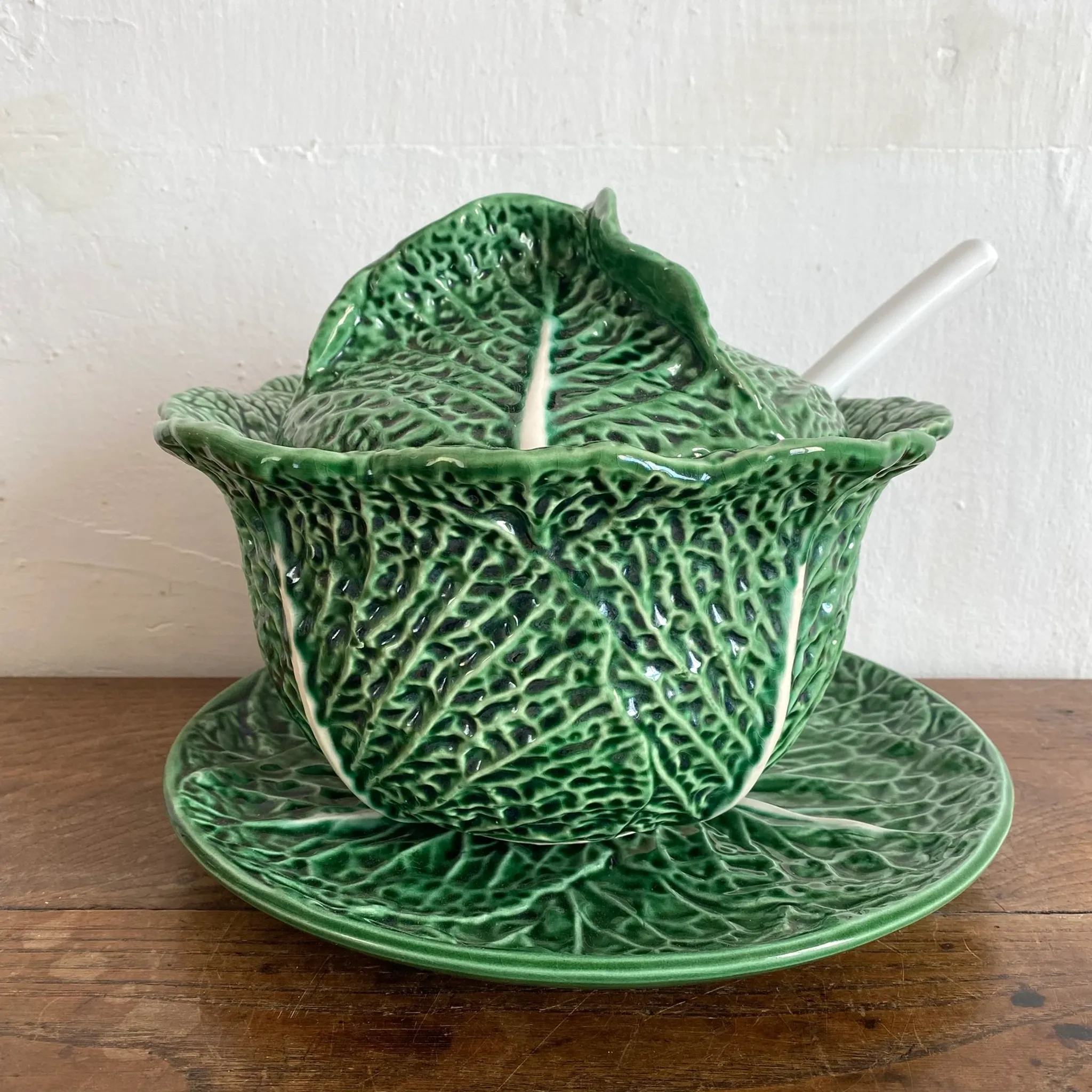 Large soup tureen in earthenware with a cabbage design, along with a dish and spoon.
