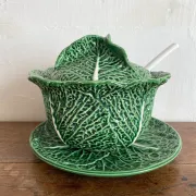 Large soup tureen in earthenware with a cabbage design, along with a dish and spoon.