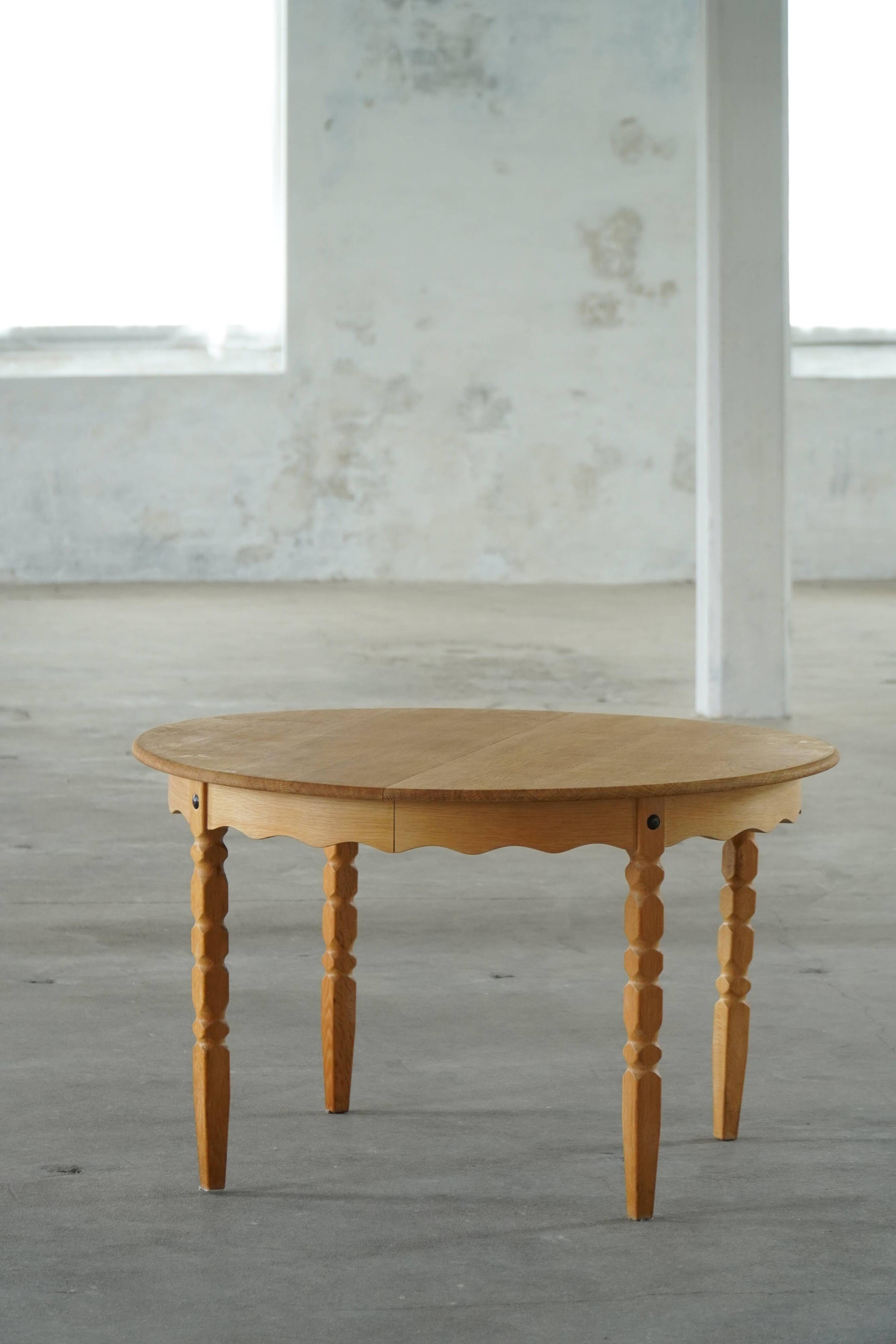 Round solid oak dining table with three extensions, mid-century Danish style, 1960s.