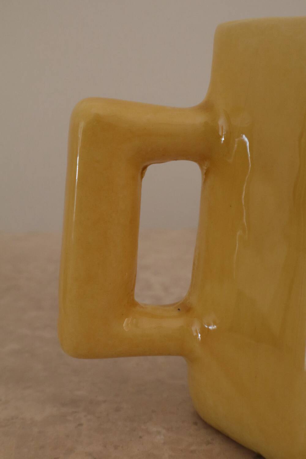 Set of two designer lemon yellow ceramic mugs