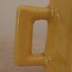 Set of two designer lemon yellow ceramic mugs