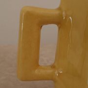 Set of two designer lemon yellow ceramic mugs