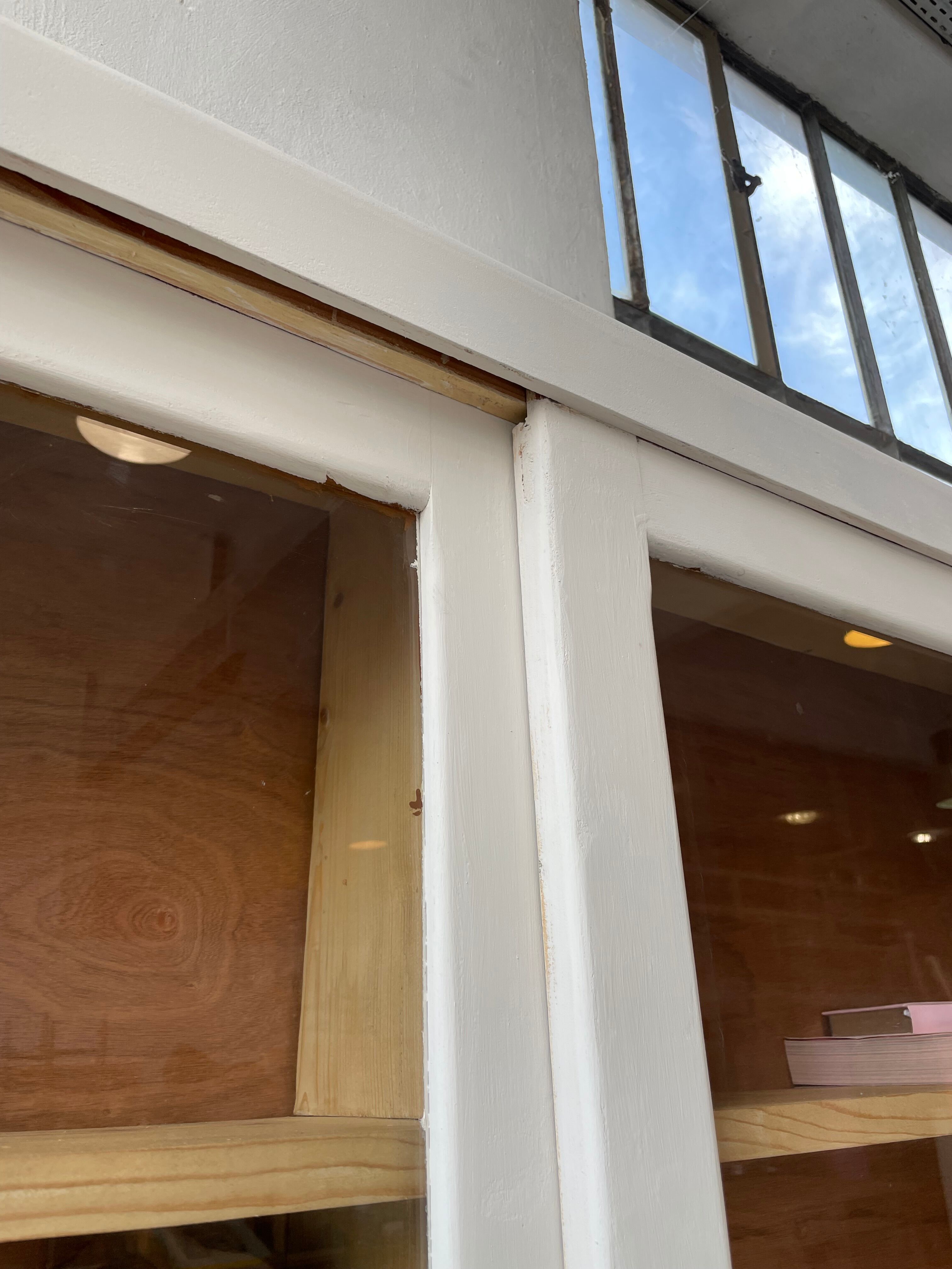 Library showcase ivory white sliding doors