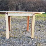 Oval table in polychrome wood
