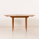 Scandinavian round teak table with hidden extension, 1970s