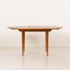 Scandinavian round teak table with hidden extension, 1970s