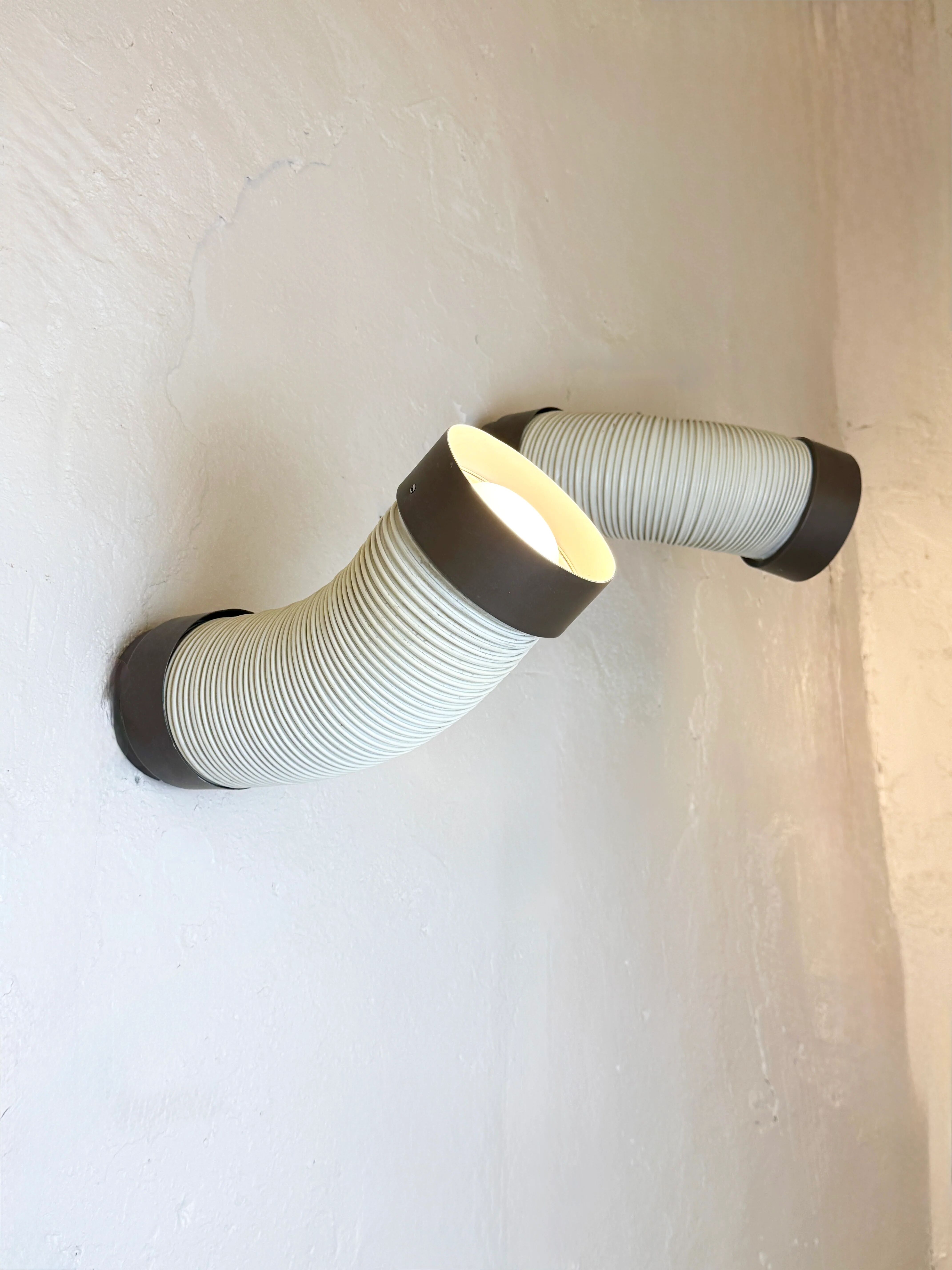 Pair of adjustable wall lights "Tuyau" by Raak, 1970s