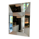 Asymmetrical beveled mirror