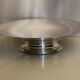 Large flat circular cut on silver metal pedestal