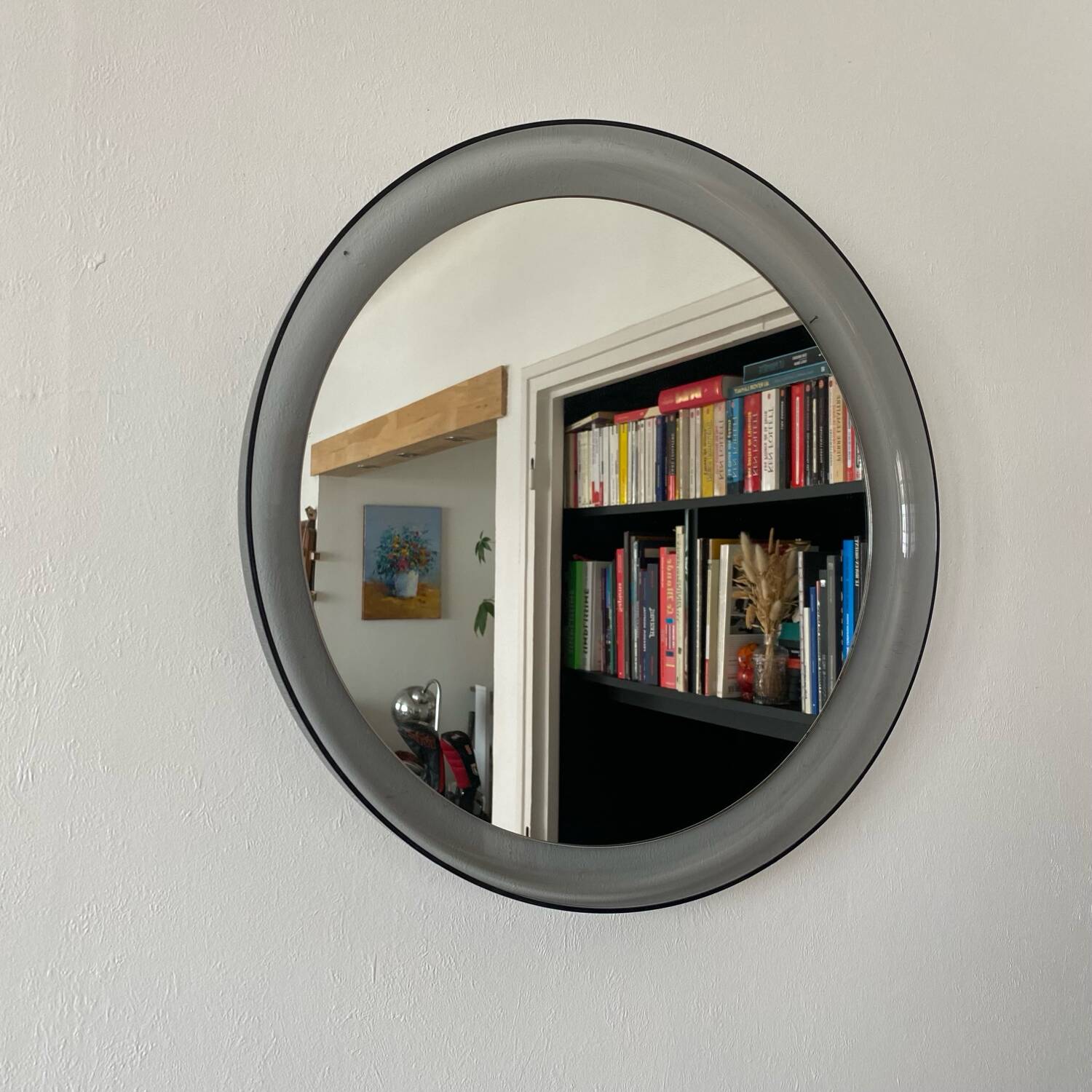 Round bluish plexiglass mirror