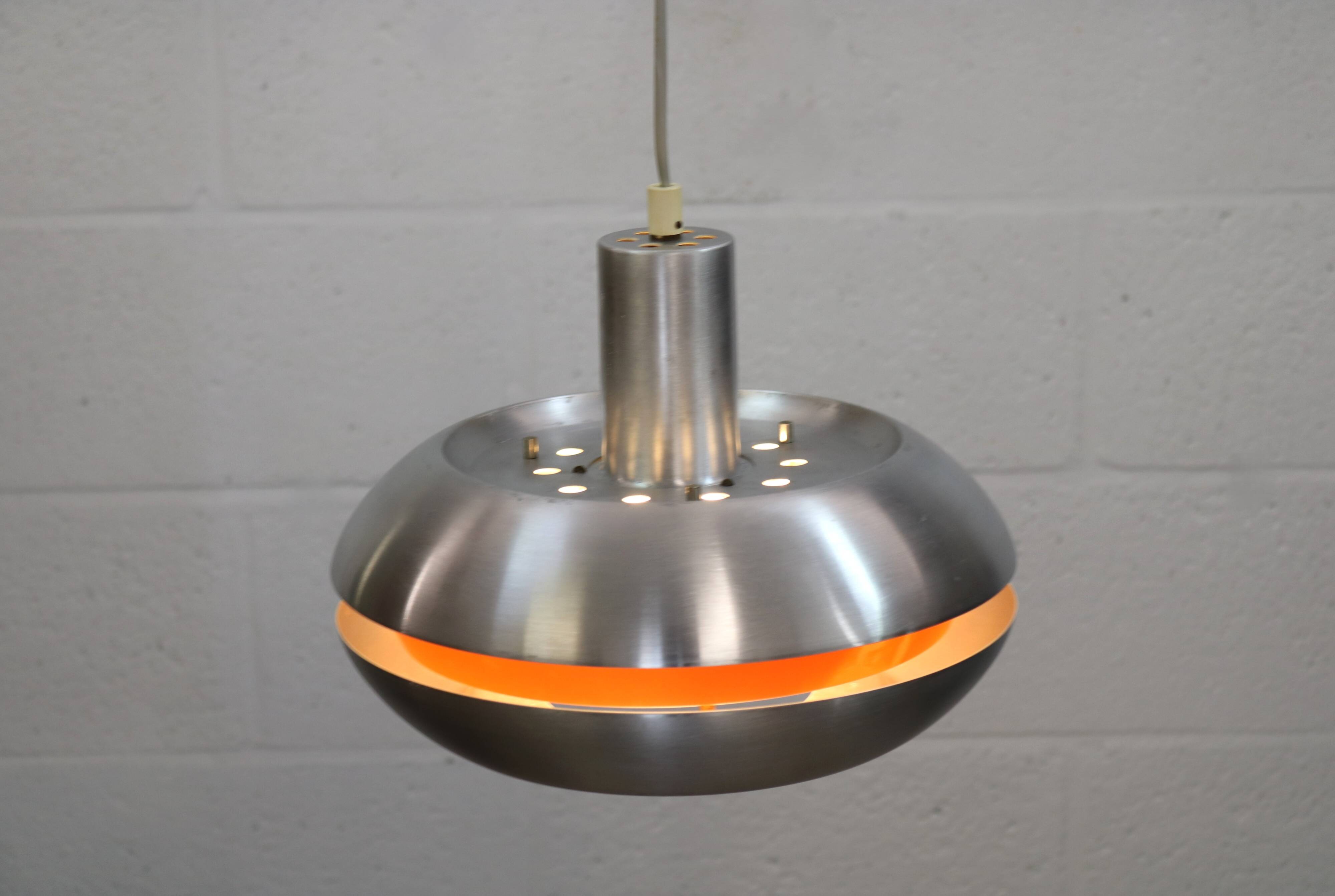 Old Danish space age design lamp in alu and orange inside.