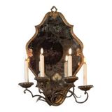 Gold metal wall mirror, in the style of Maison Baguès, Paris circa 1950.