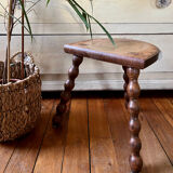 Low vintage wooden tripod stool