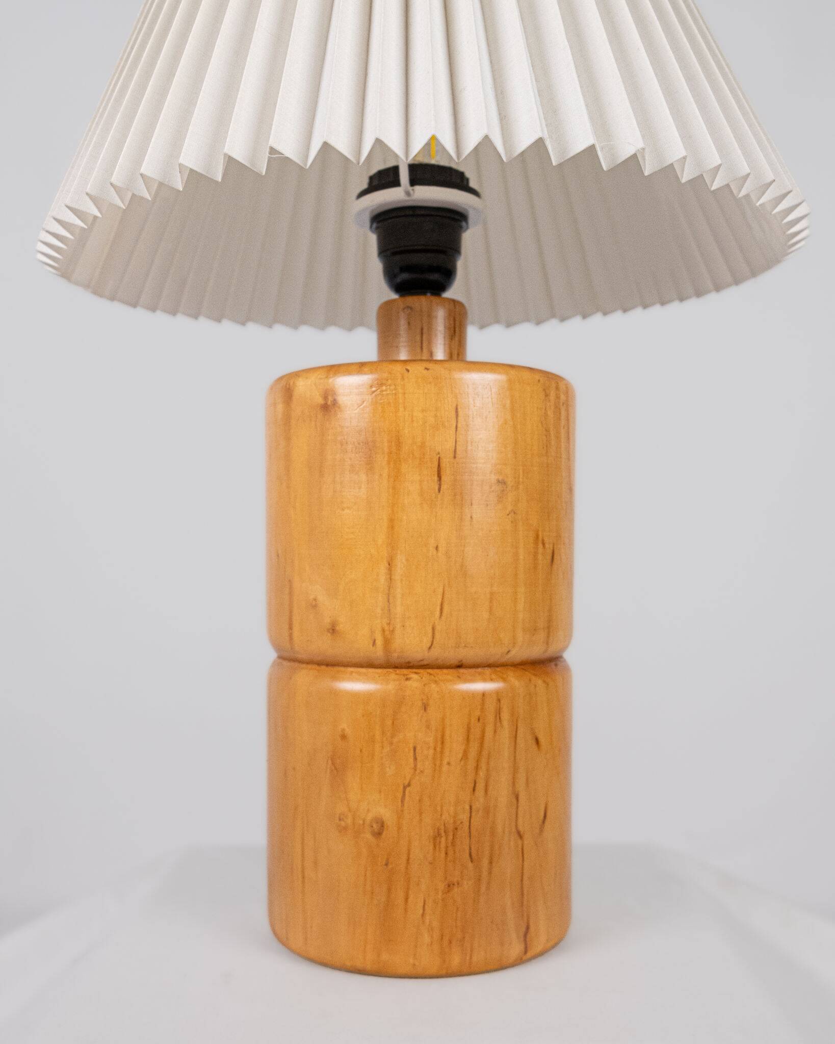 Cylindrical table lamp made of solid turned wood, France, 1970.