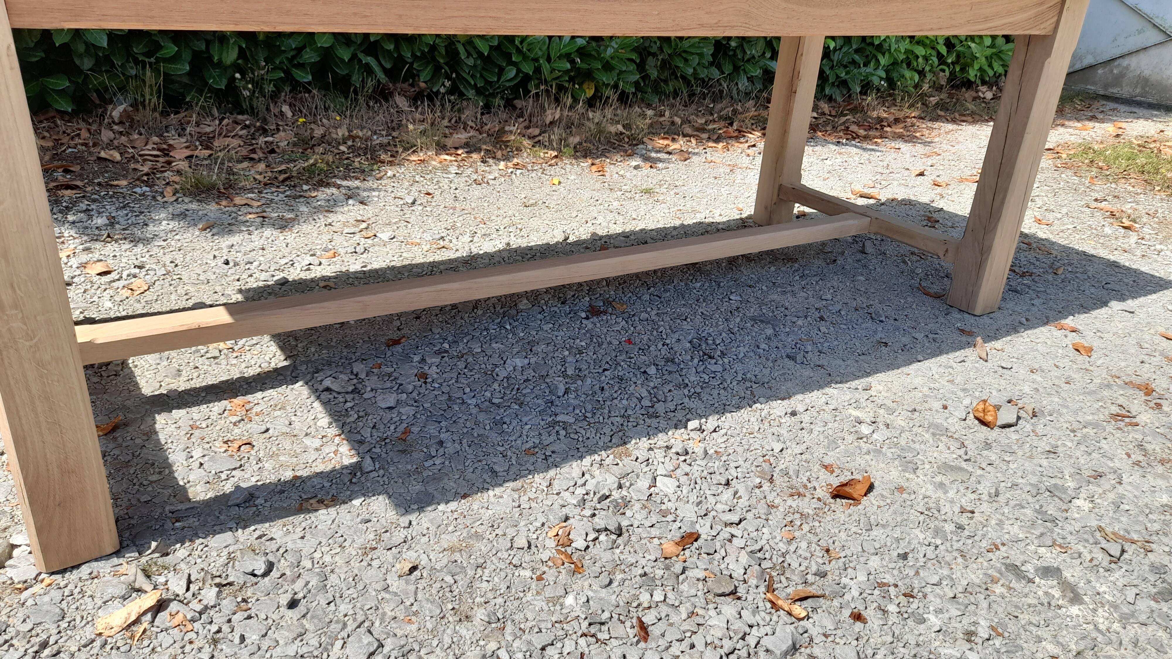 Solid oak farmhouse table in raw wood