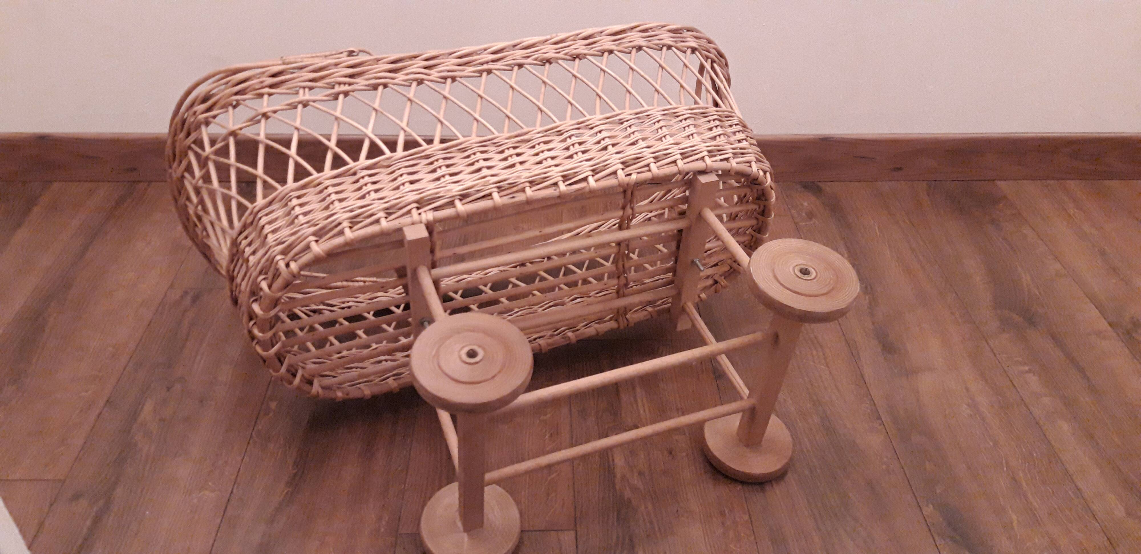 Vintage wicker cradle with wheels