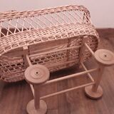 Vintage wicker cradle with wheels