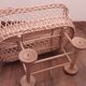 Vintage wicker cradle with wheels