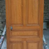 Old communication door with wood effect paint