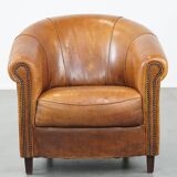 Sheep leather club chair in a cognac color with patina