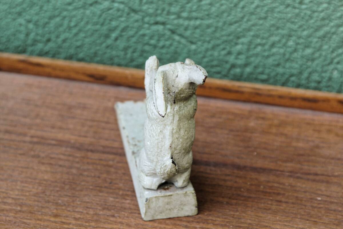 Old cast iron rabbit door wedge