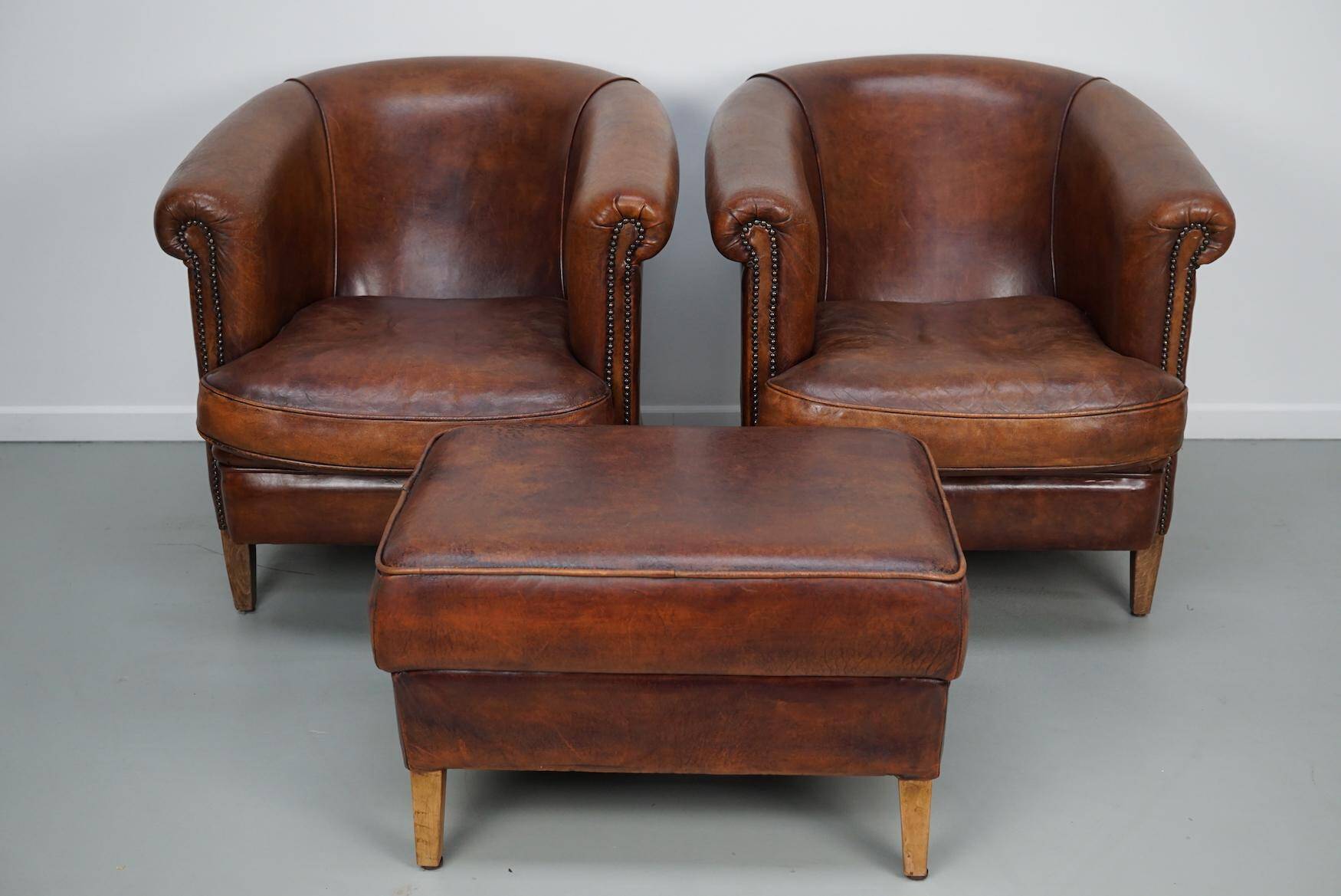Vintage Dutch cognac coloured leather club chair, set of 2 with footstool
