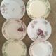 Flat old plates mismatched with flowers