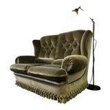 Vintage green two-seater sofa with fringes