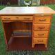 Vintage oak desk with 5 drawers and 1 pull.