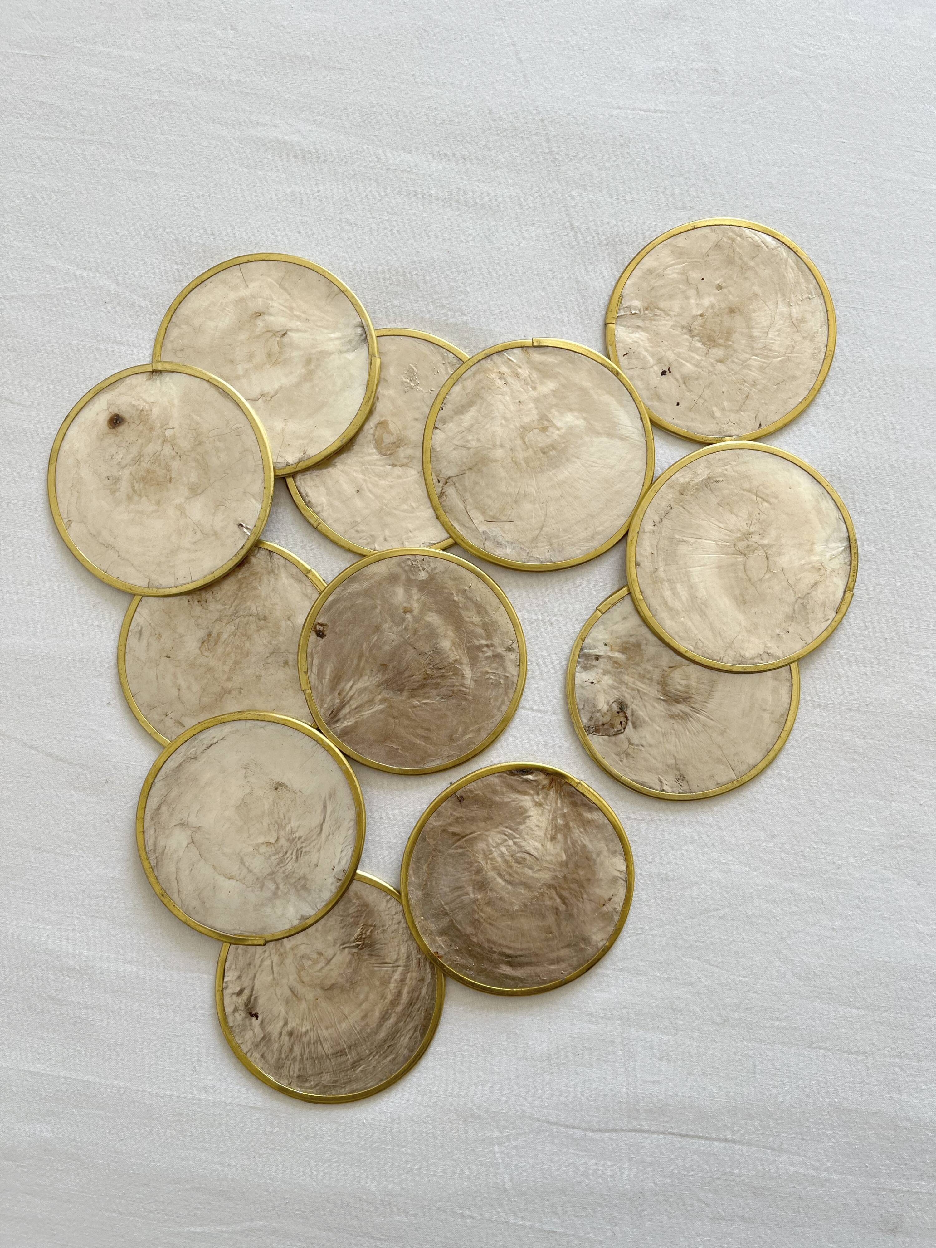 12 coasters in mother-of-pearl and vintage brass