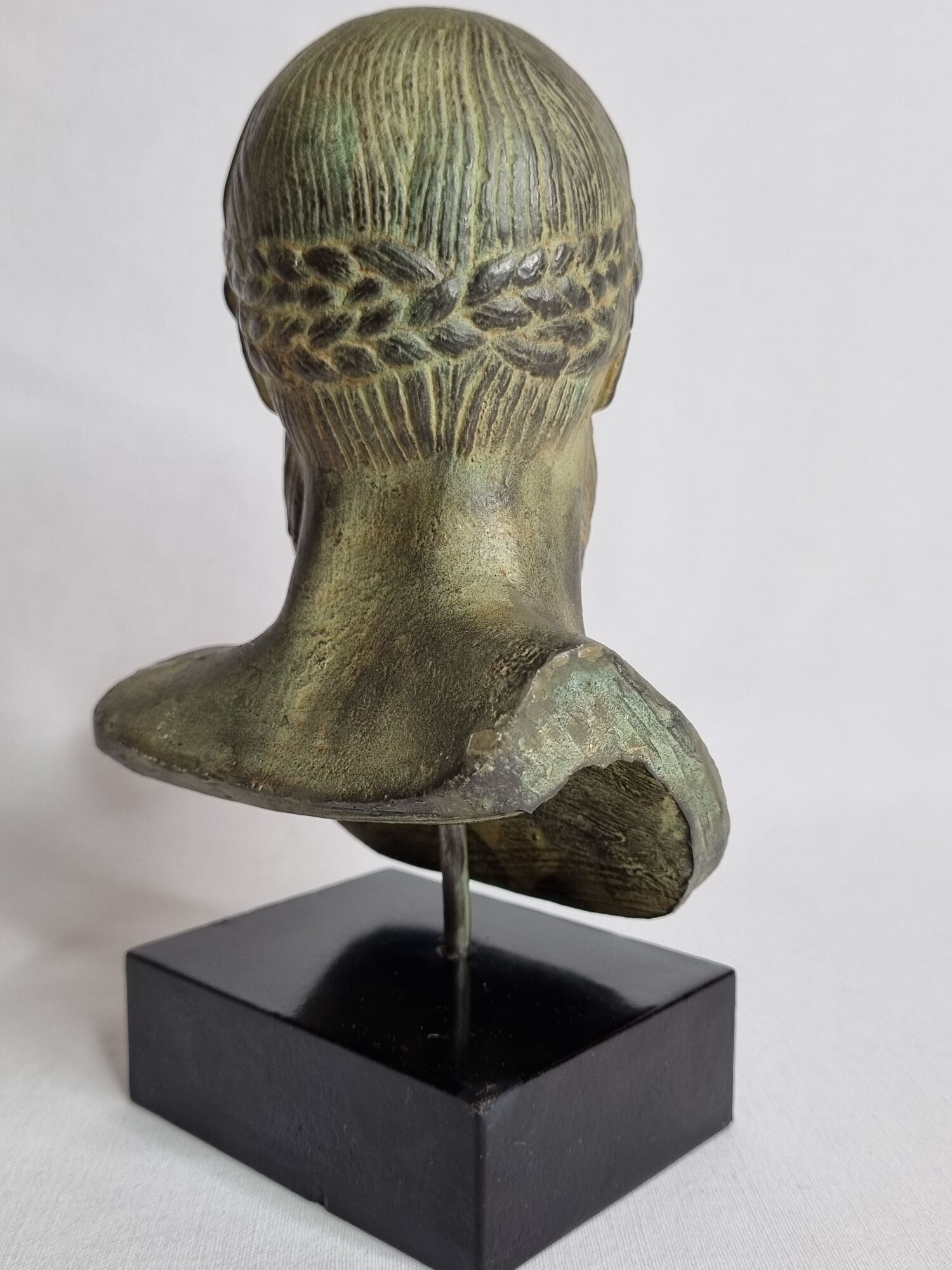Bust of Poseidon in patinated plaster on wooden base