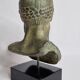 Bust of Poseidon in patinated plaster on wooden base