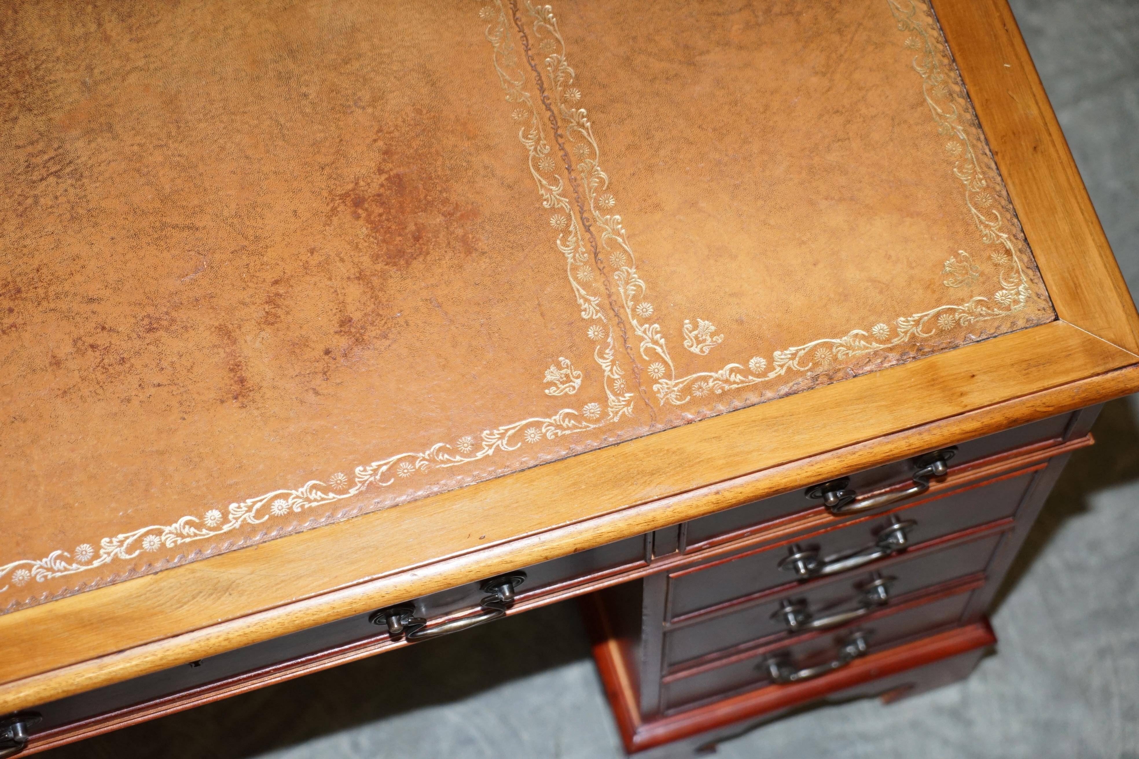 Vintage walnut desk with a leather top and two drawers.