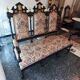 Historicist three-seater canapé in ebonised wood.