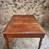 Antique French walnut table with six drawers, parquet top, early 20th century.