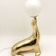 Vintage brass sea lion lamp