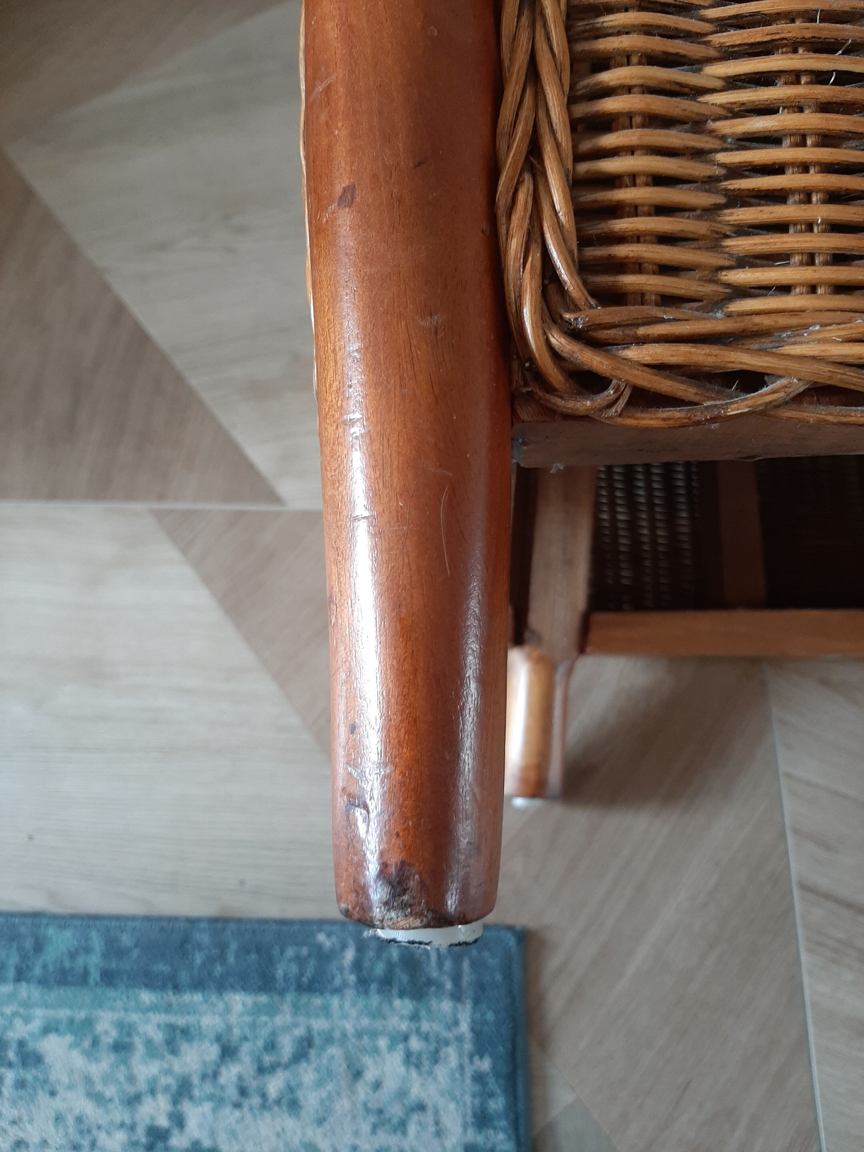 Armchair in woven rattan and exotic wood