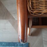 Armchair in woven rattan and exotic wood