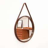 Round mirror in walnut