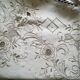 Round off-white tablecloth embroidered with grey flowers with 8 matching napkins - festive table