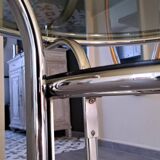 Round table in chromed metal and smoked glass