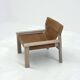 Stylish vintage armchair with saddle leather seat