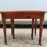 6-foot oval table with caramel patina extensions