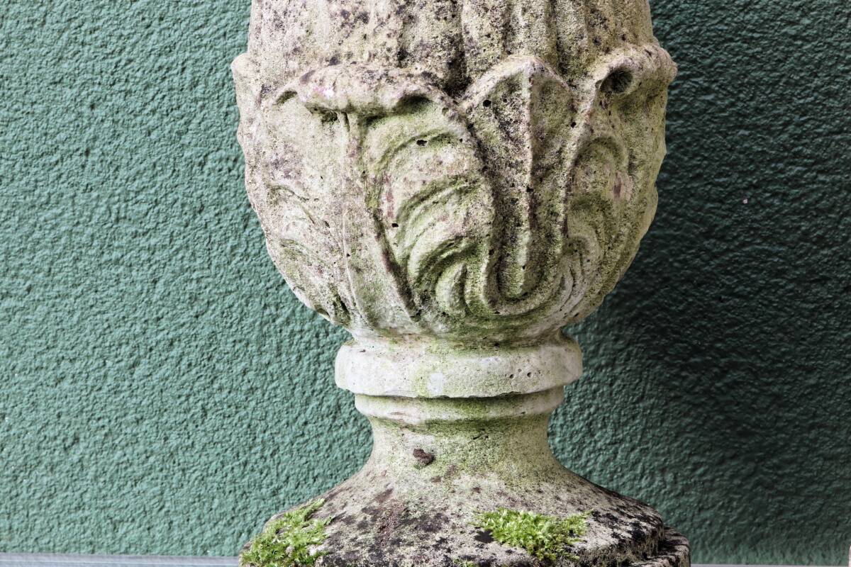 Pair of pine cones in reconstituted stone