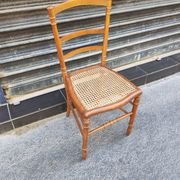 Antique wooden chair with cane seating