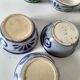 7 stoneware bowls with blue and green ocean-inspired decoration